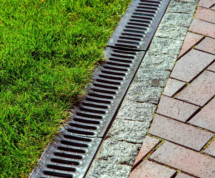 Yard drainage channel grate installation